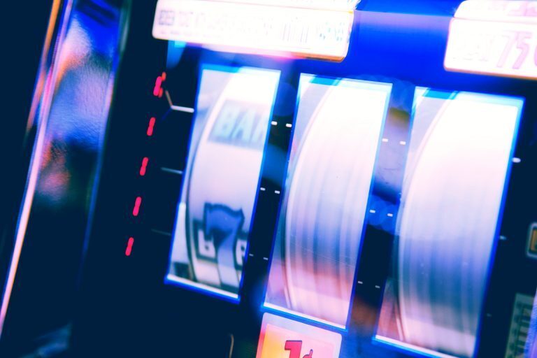 reels spinning on a three reel slot machine