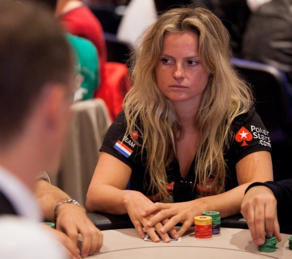 Fatima Moreira de Melo dutch field hockey player holding cards, chips and playing poker during celebrity tournament