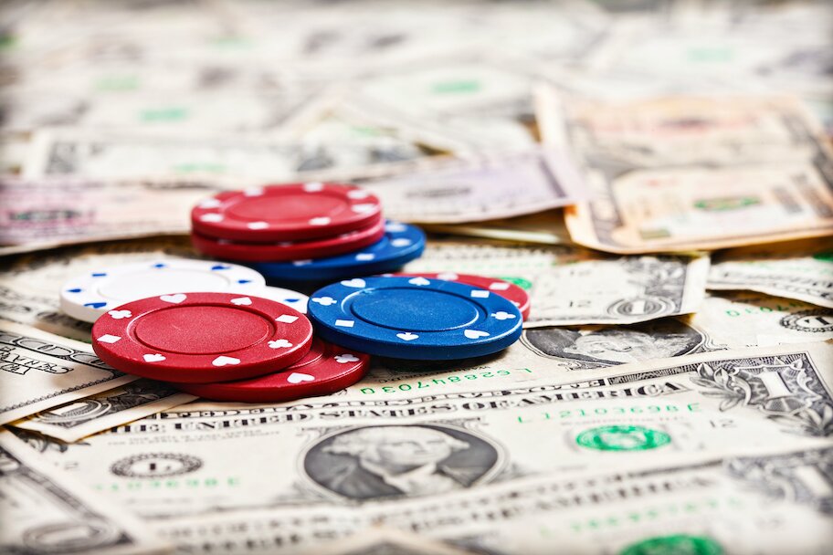 poker chips on pile of money