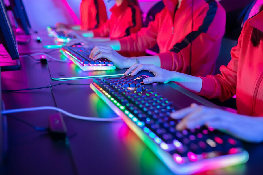 esports team playing game on light up RGB keyboards