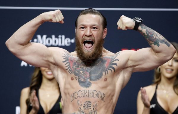 Conor McGregor poses for weigh in