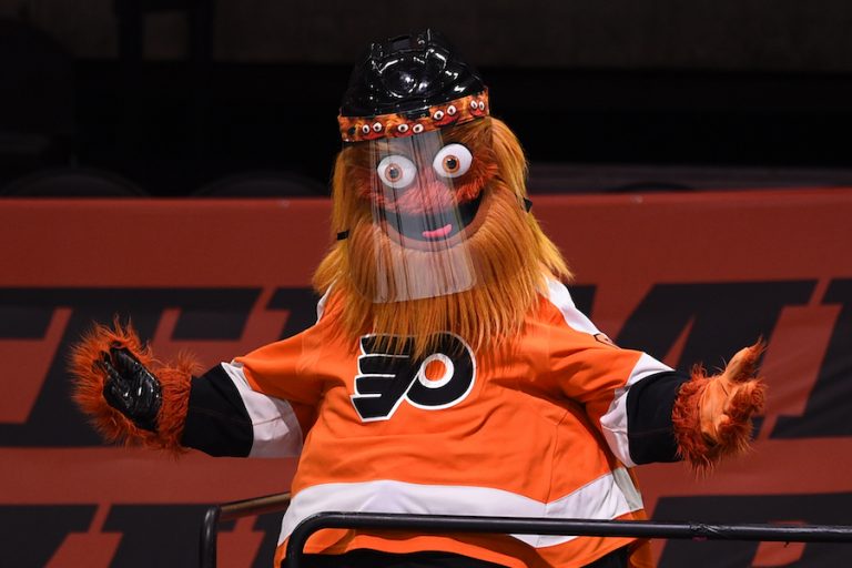 NHL mascot Gritty entertains fans while wearing a protective visor