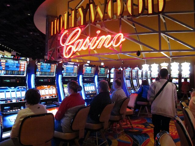 gamblers playing slot machines at the Hollywood Casino Columbus