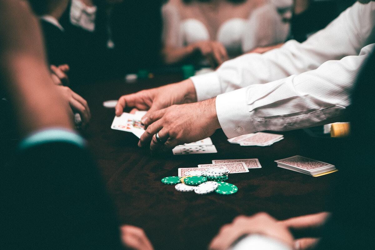 casino dealer shuffles cards during game